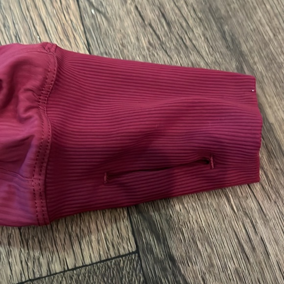 Lululemon reversible hooded jacket in magenta. Has thumb holes. Size 8. - Picture 7 of 7